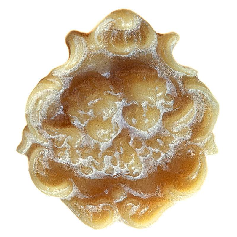 Beeswax figurine with angels front view